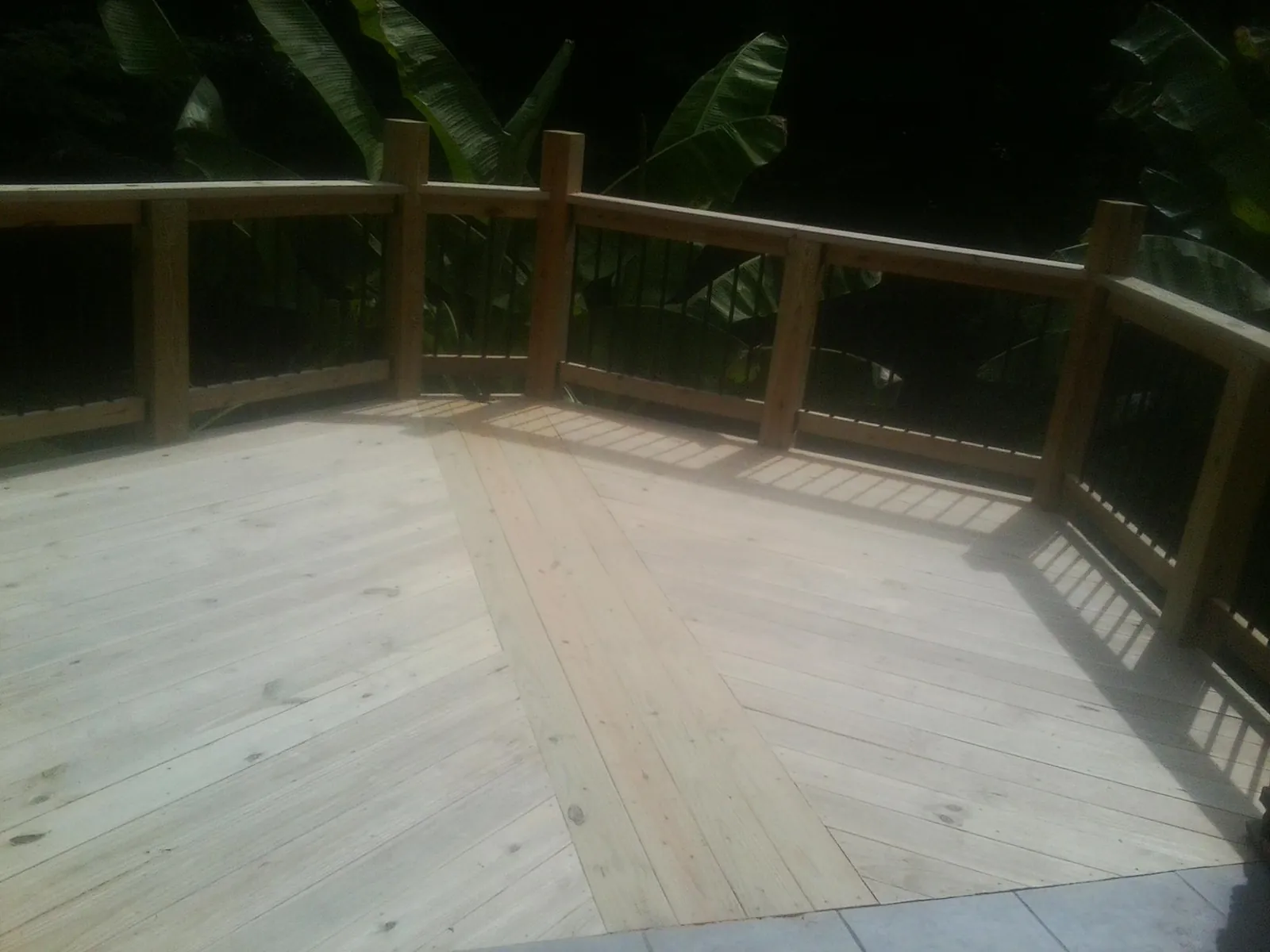New wood deck and railing built off the back of a home in Port Orford